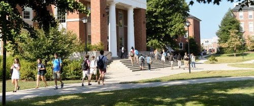 Students walking to class in front of the Young building
