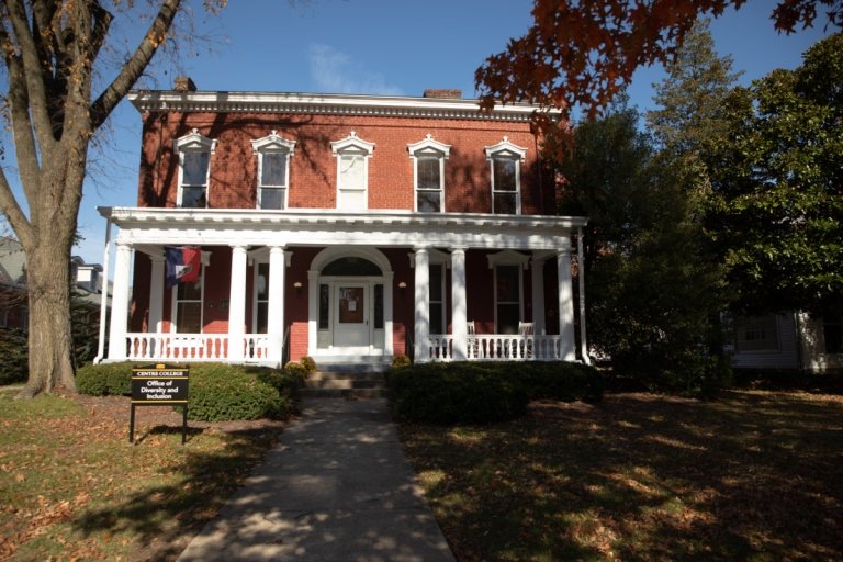 exterior of two story brick house with porch on front