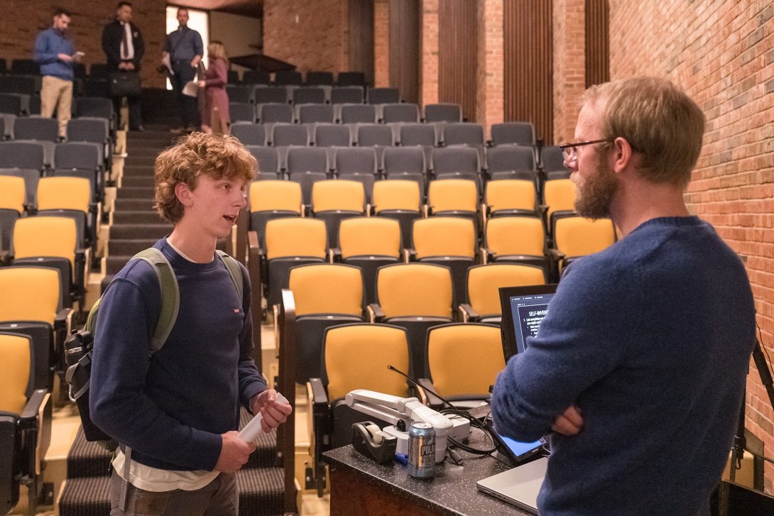Humana Visiting Lecturer J. Christian Jensen visited with Chase Sweger during a workshop in March, 2023.