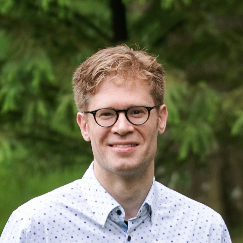 Person wearing glasses smiling