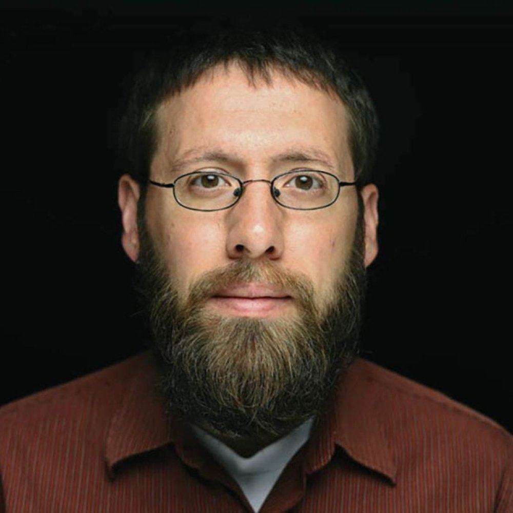 Person wearing glasses smiling