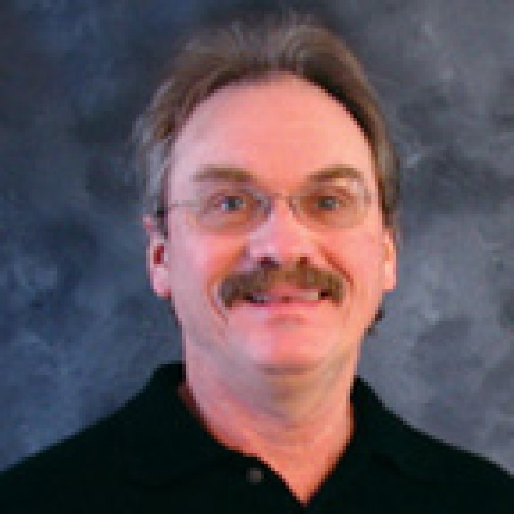 Person wearing glasses smiling