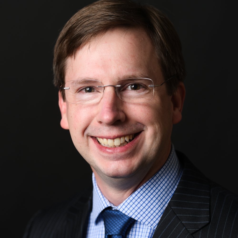Person wearing glasses smiling