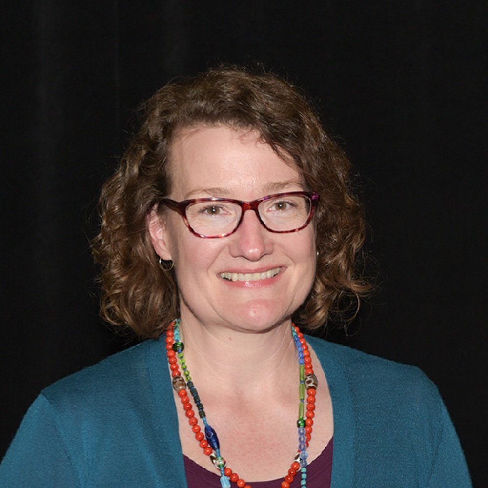 Person wearing glasses smiling