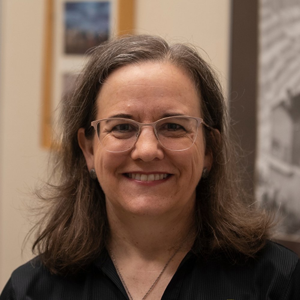 Person wearing glasses smiling