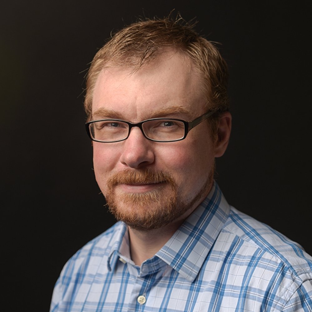 Person wearing glasses smiling