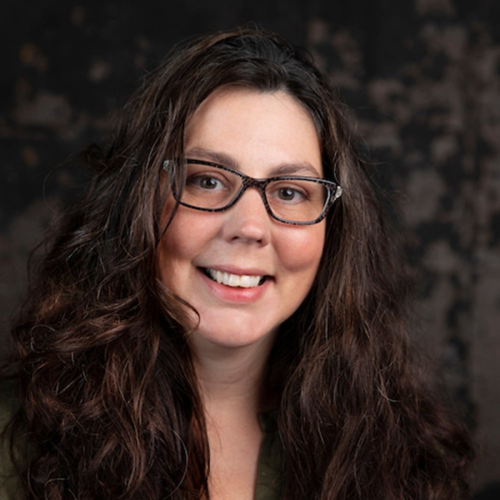 Person wearing glasses smiling