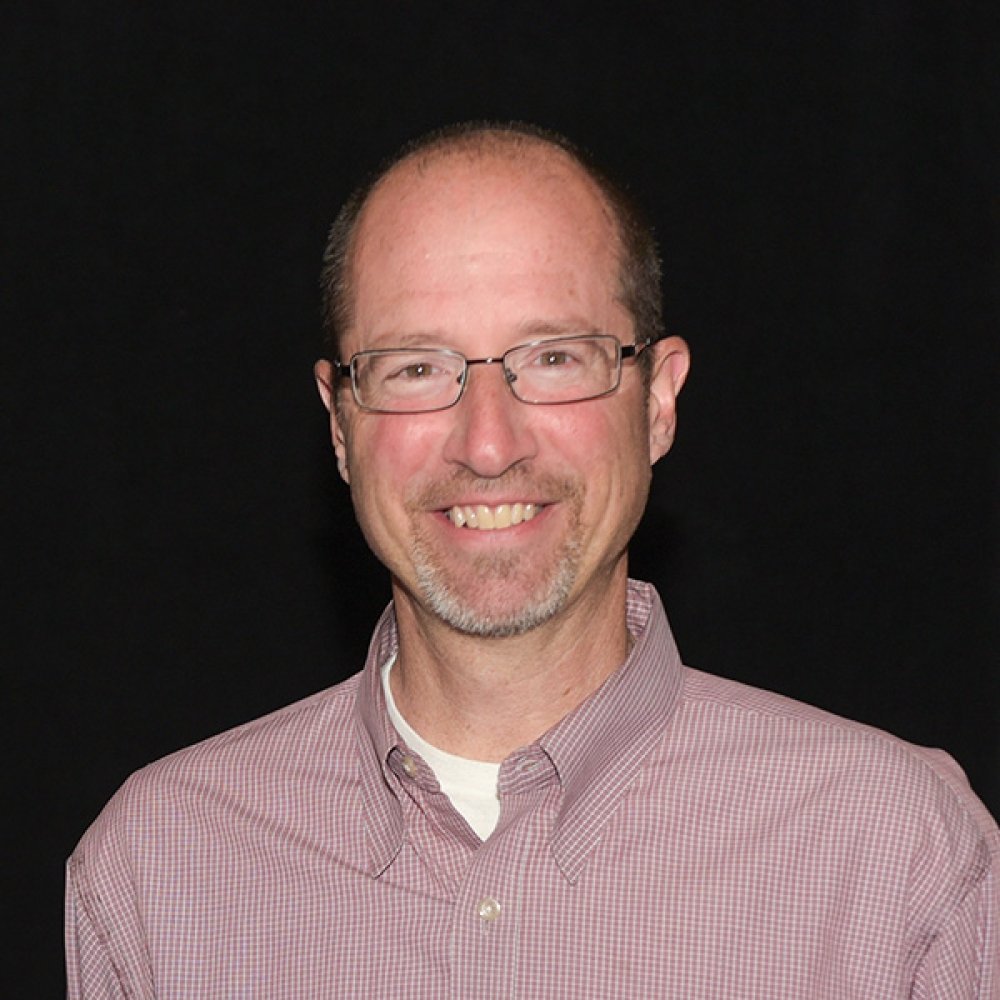 Person wearing glasses smiling
