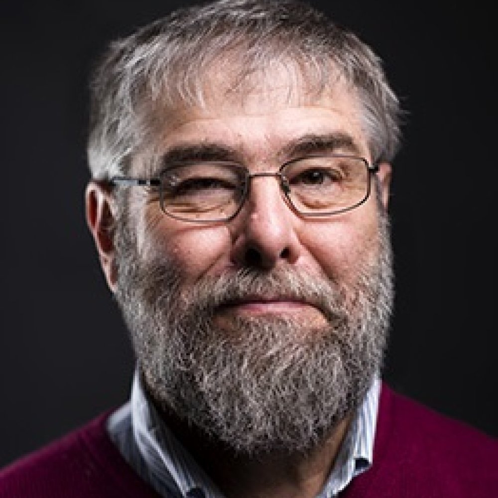 Person wearing glasses smiling