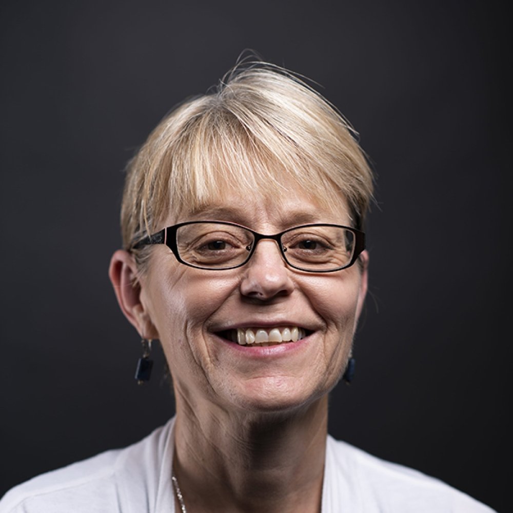Person wearing glasses smiling