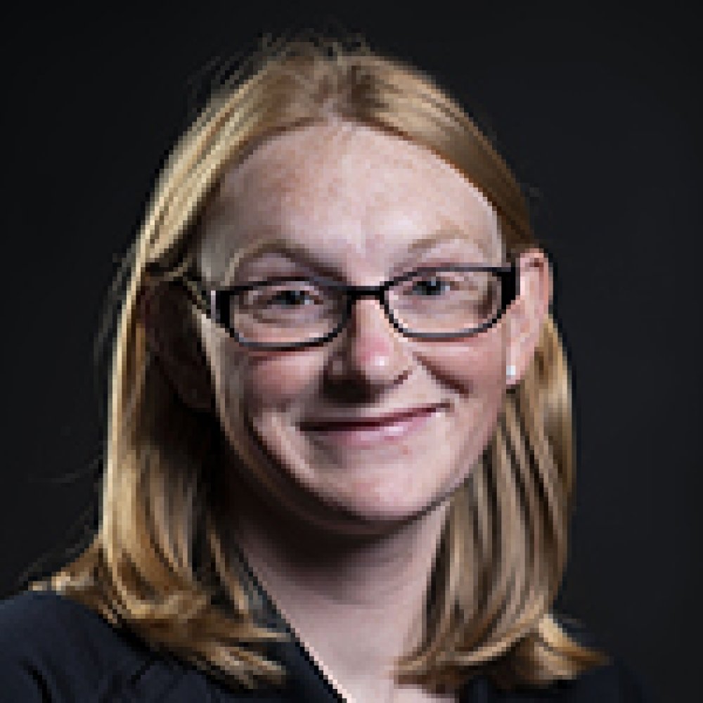 Person wearing glasses and smiling