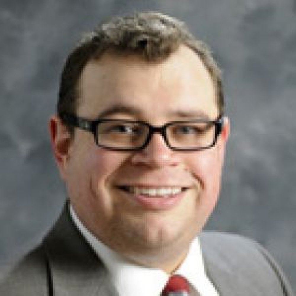 Person wearing glasses smiling