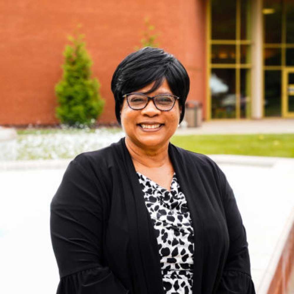 Person wearing glasses and smiling