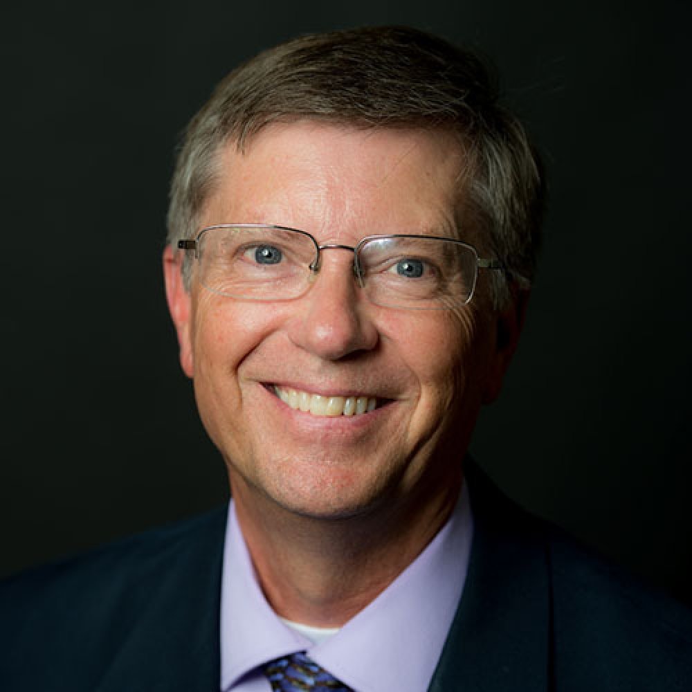 Person wearing glasses smiling