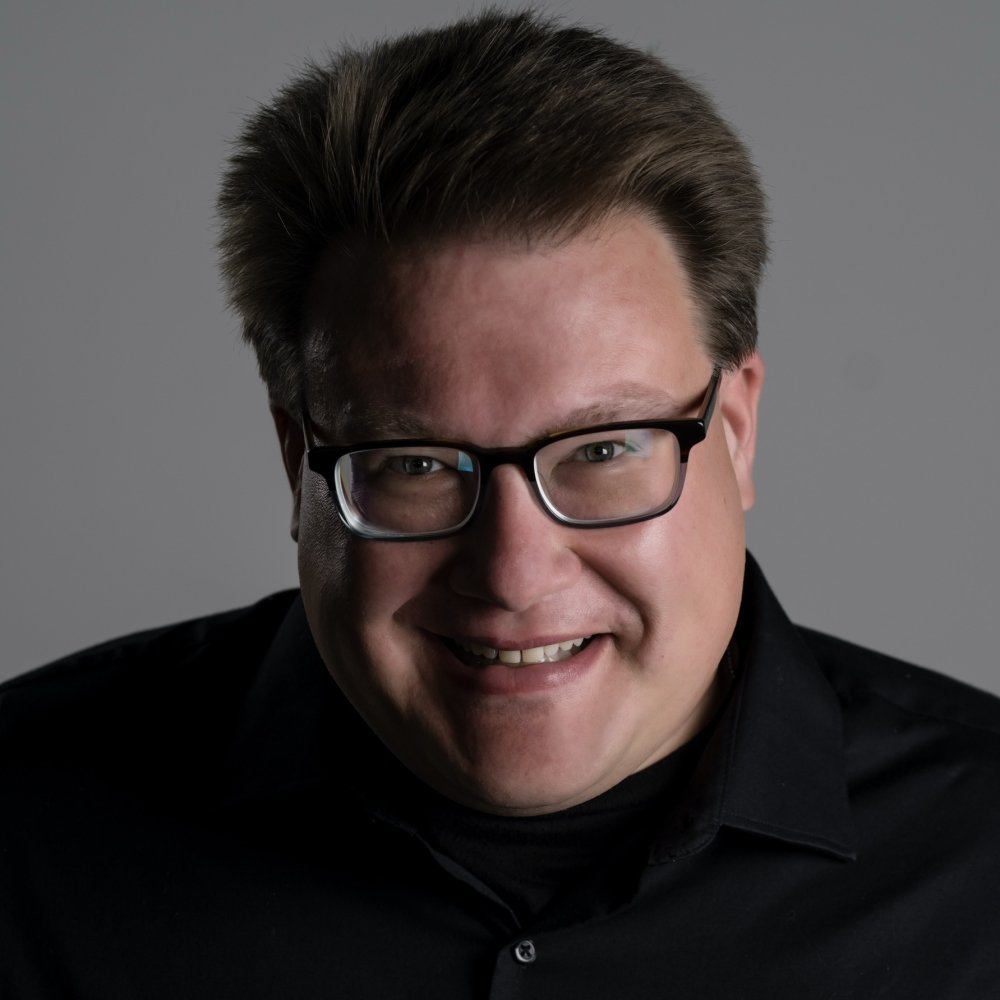Person wearing glasses smiling