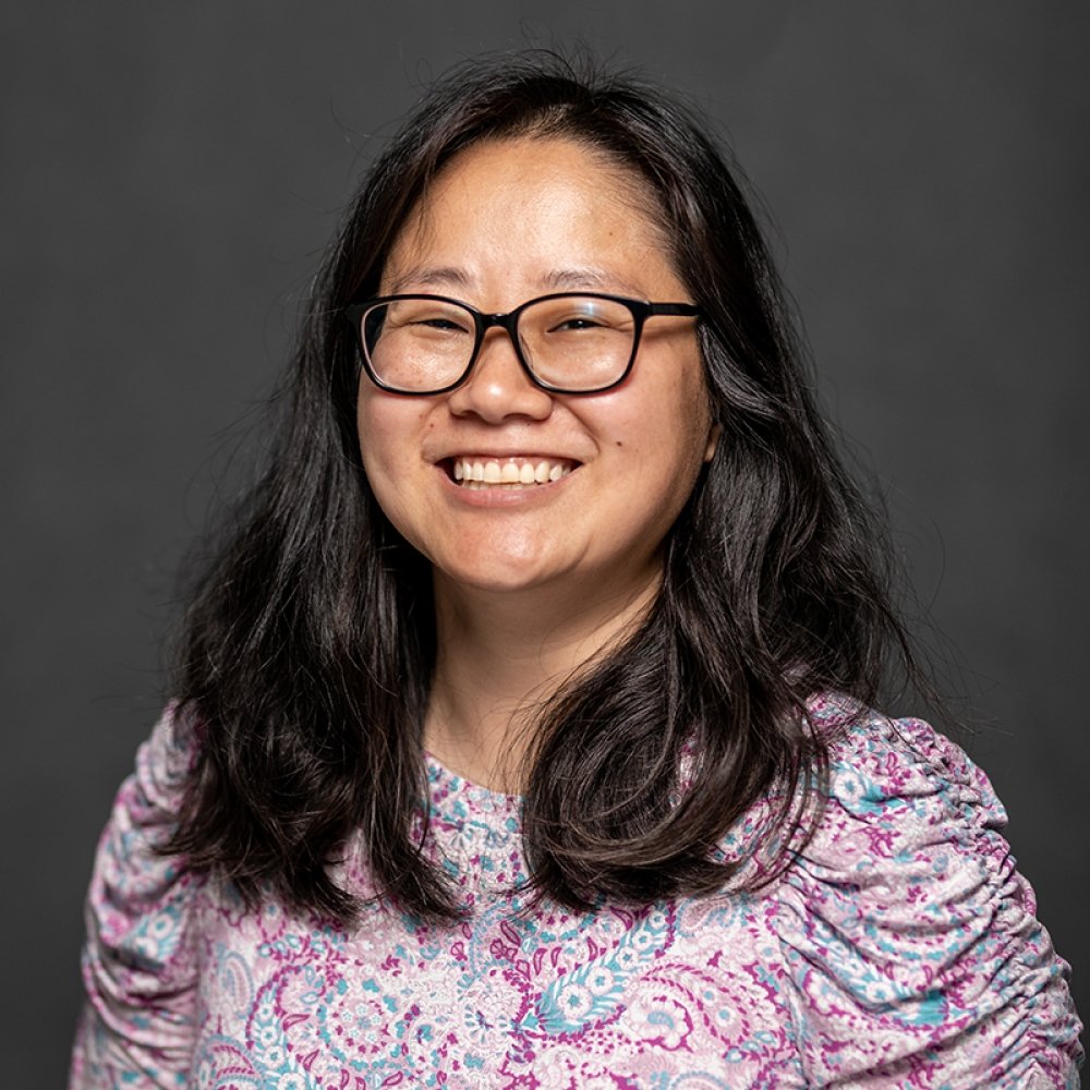 Person wearing glasses and smiling