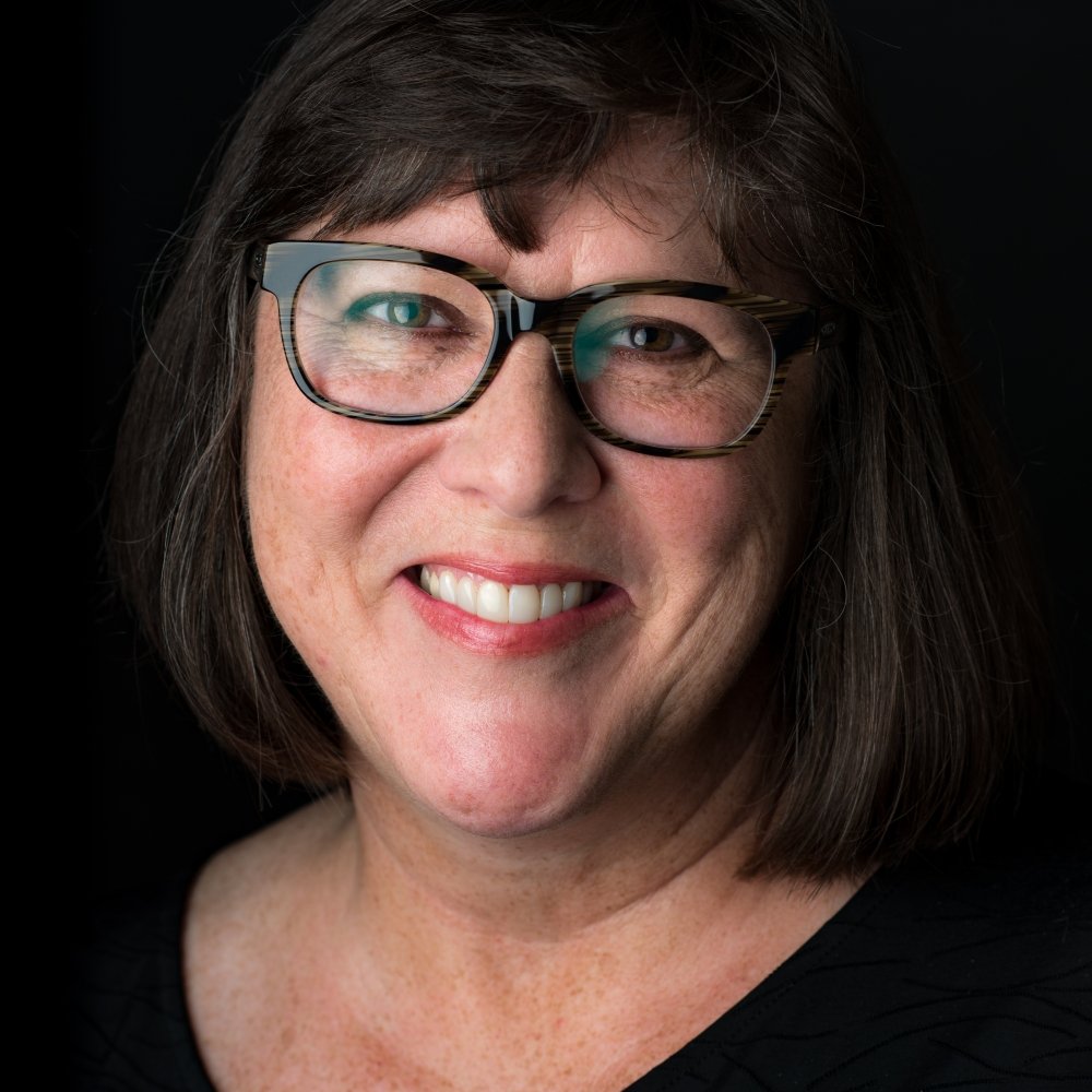 Person wearing glasses and smiling