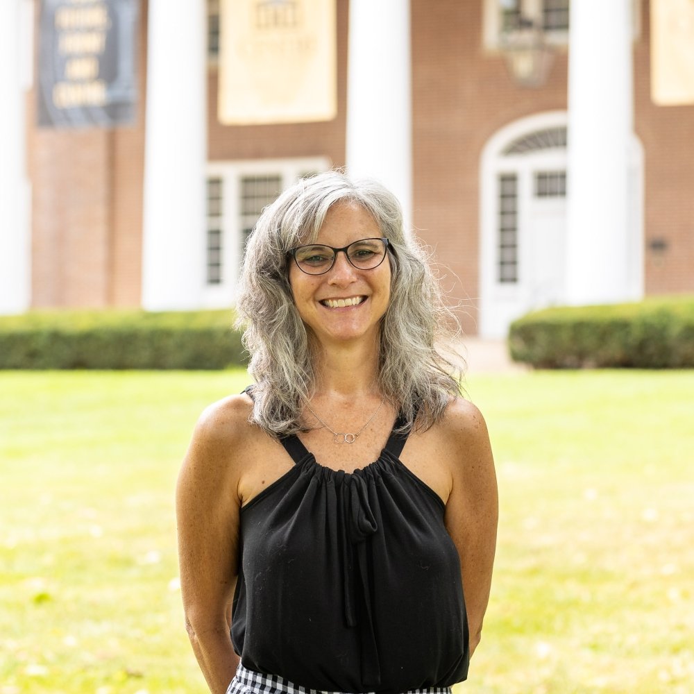 Person wearing glasses smiling