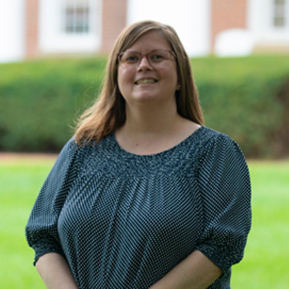 Person wearing glasses and smiling