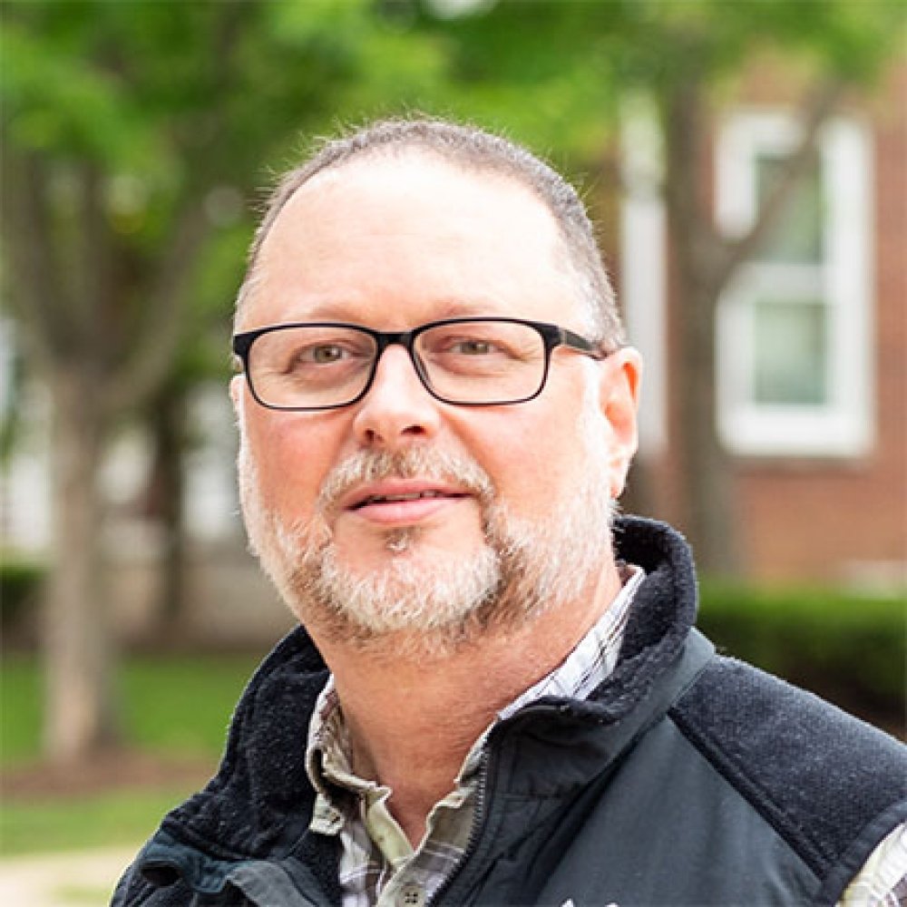 Person wearing glasses and smiling