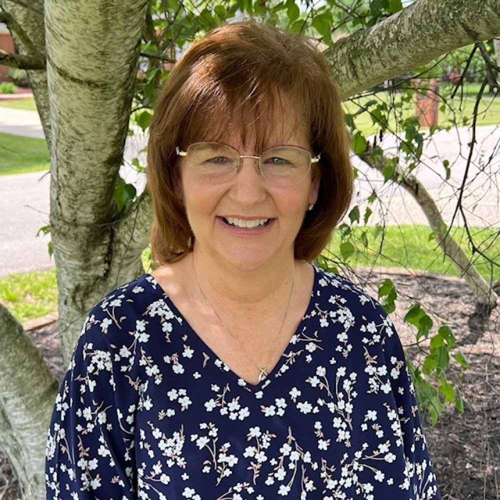 Person wearing glasses smiling