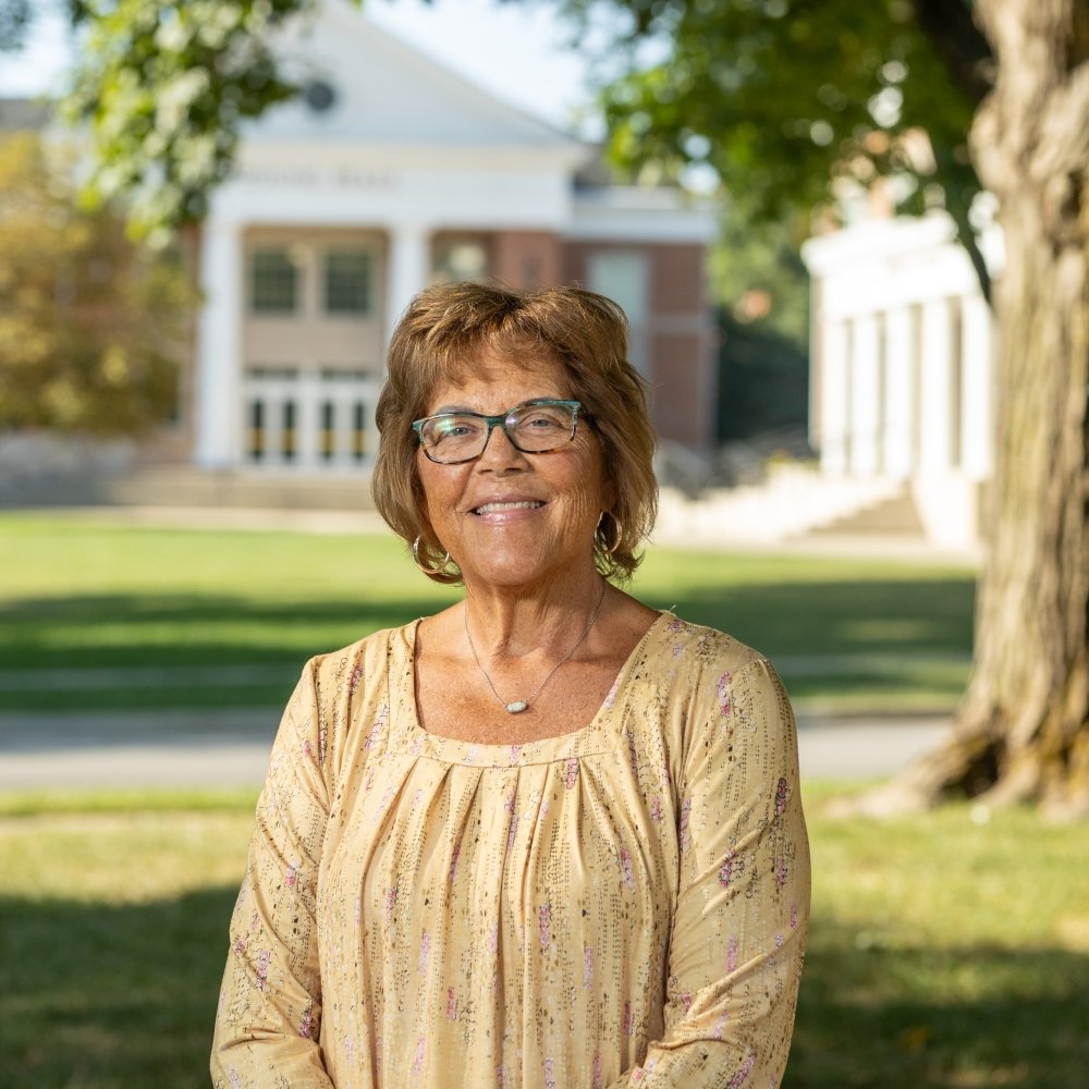 Person wearing glasses and smiling