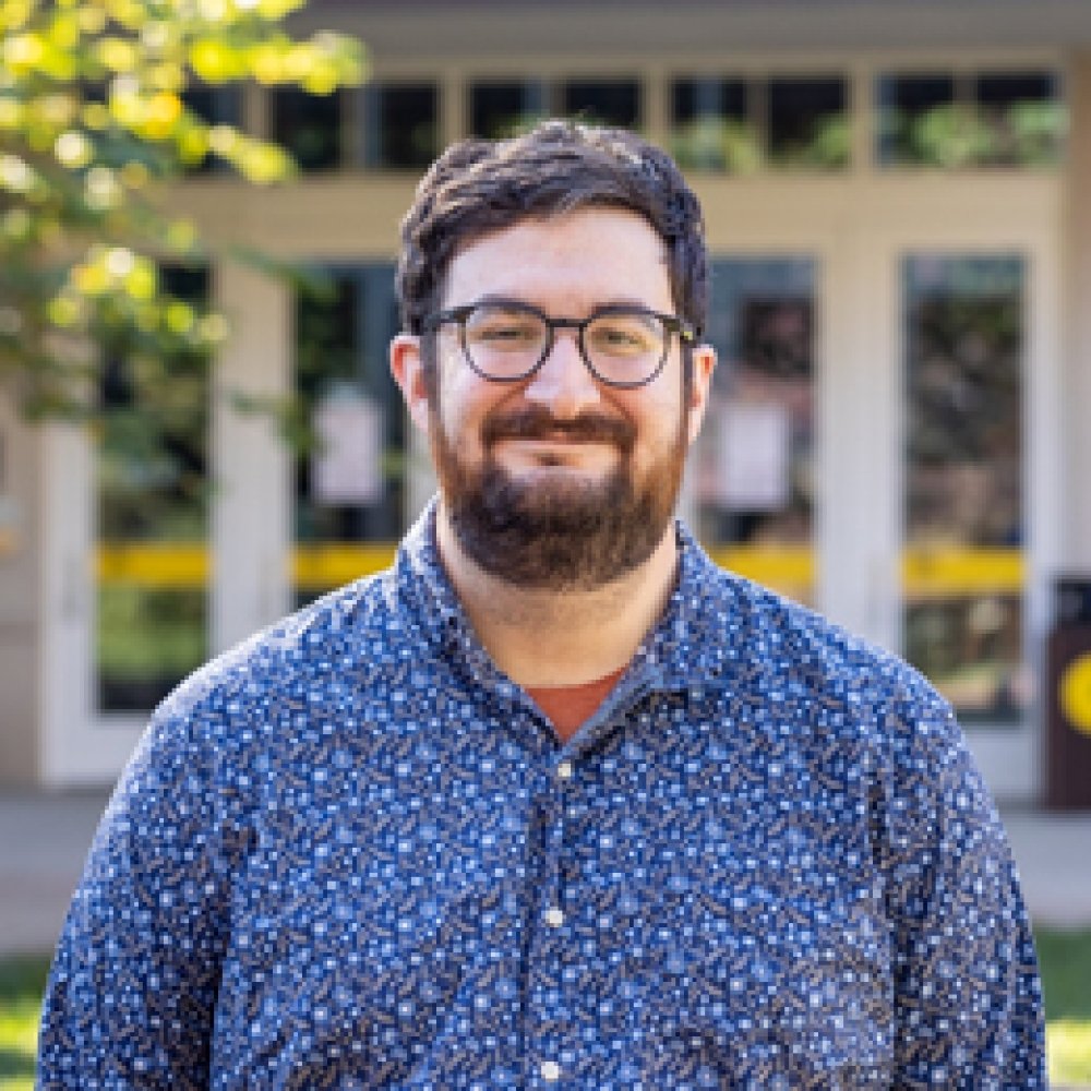 Person wearing glasses and smiling