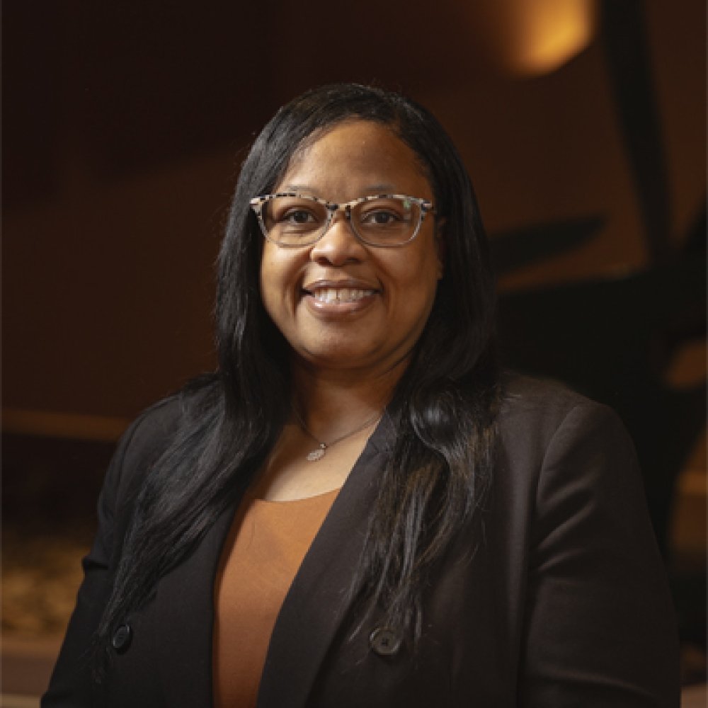 Person wearing glasses and smiling