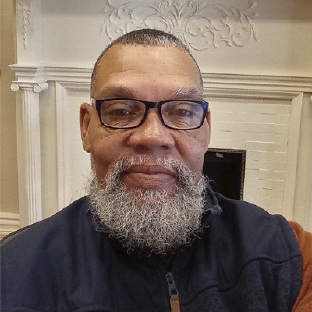 Person wearing glasses and smiling