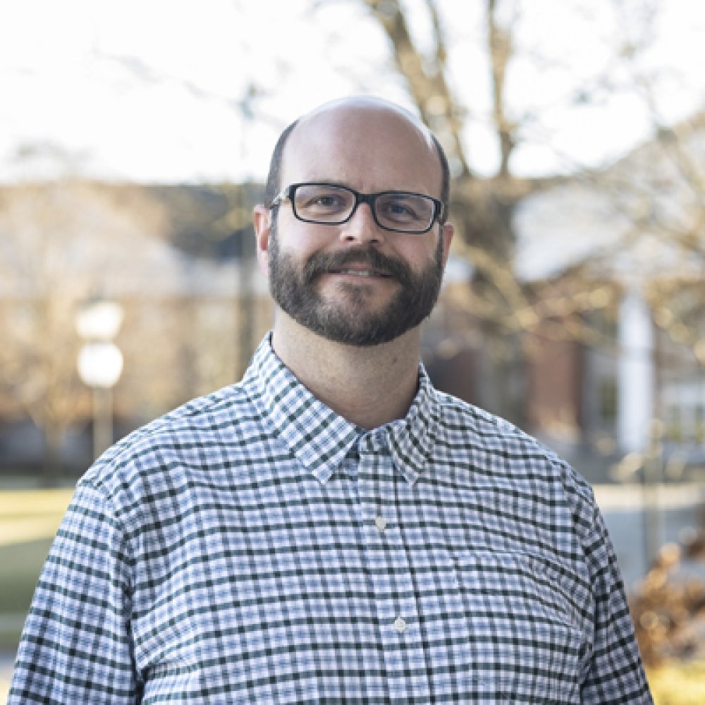 Person wearing glasses and smiling