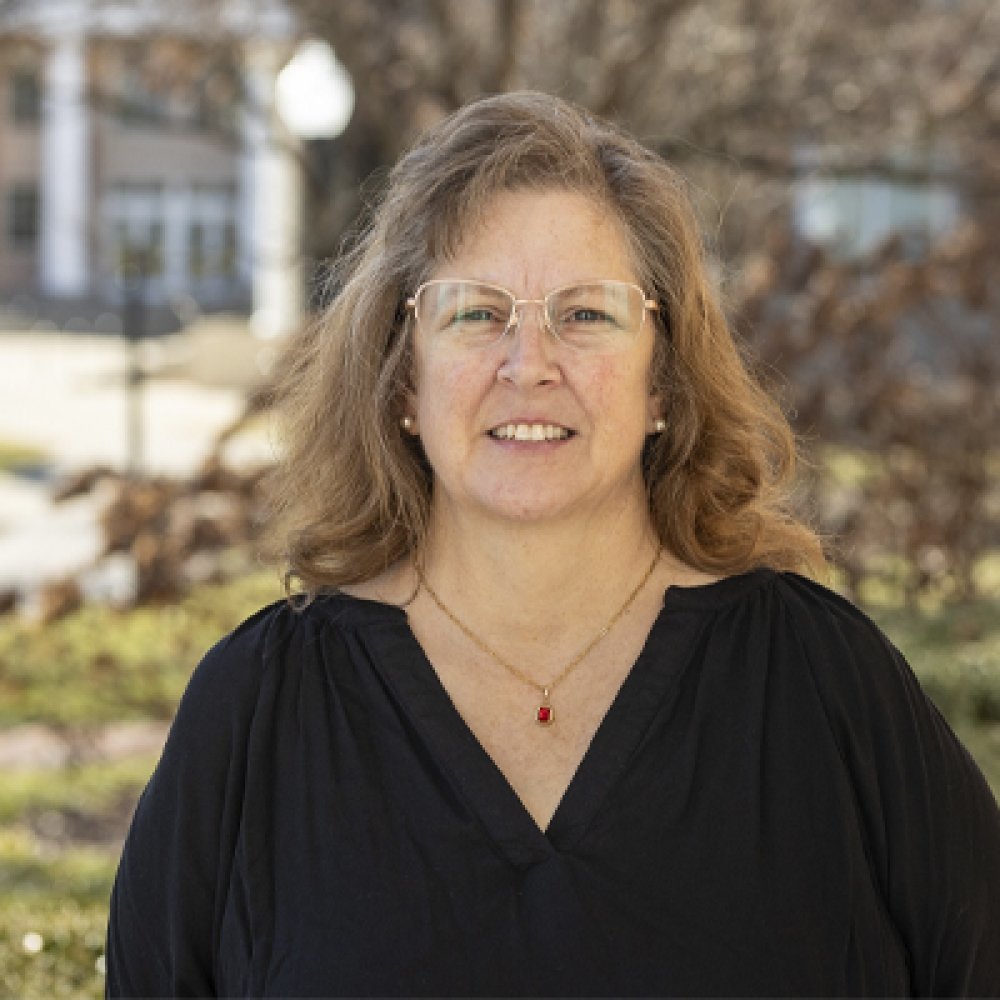 Person wearing glasses and smiling