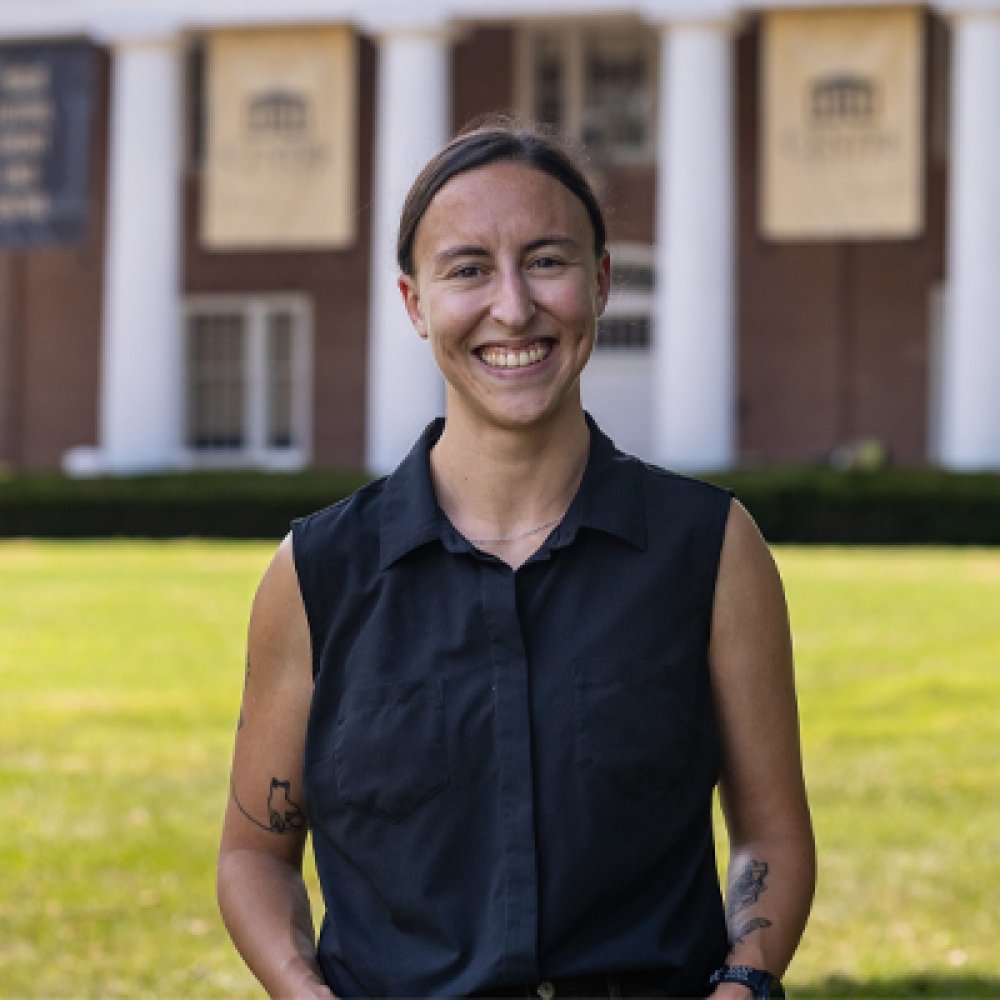 Person wearing black top and smiling at camera
