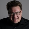 Person wearing glasses smiling