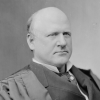 A black and white portrait of Justice John Marshall Harlan