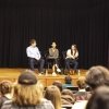 Caleb Cambell '20, Me Me Khant '20 and Dr. Erika Brewer '18 sit in front of a student audience.