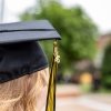 A graduate's tassel with a "26" charm."
