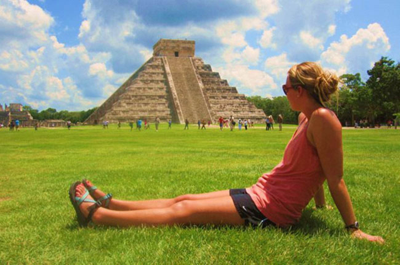 Centre student sitting in front of Mayan ruins in Yucatan, Mexico