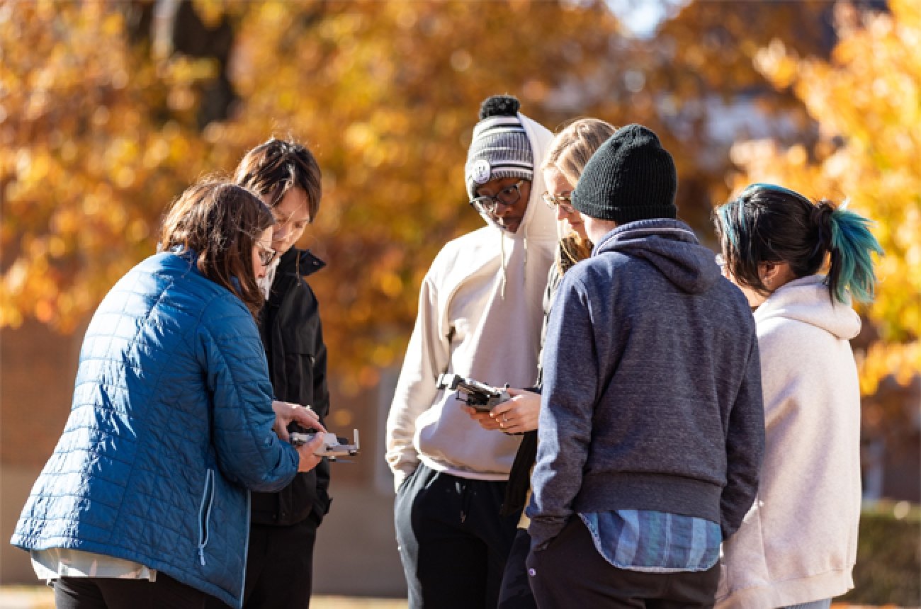 Candace Wentz along with Centre students using a drone during fall