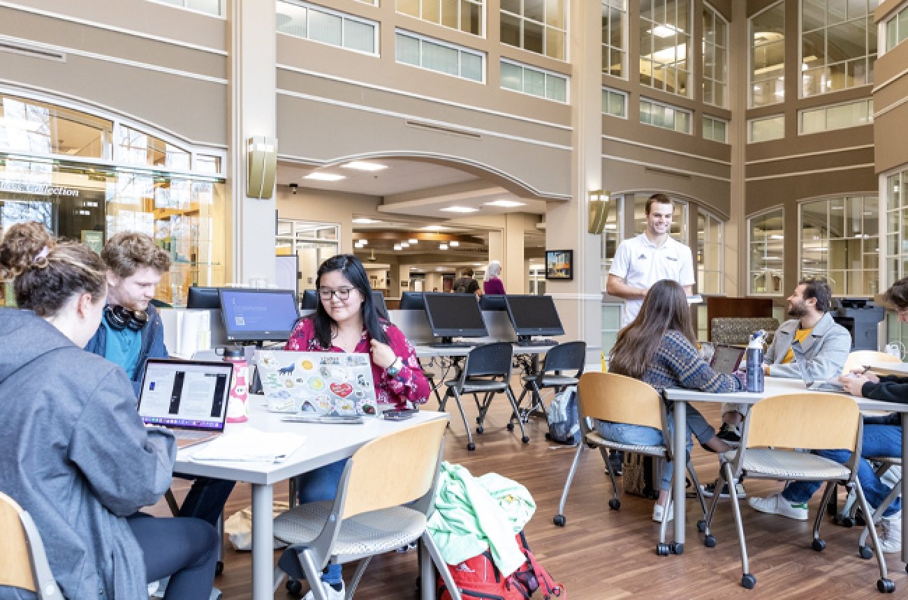 Center Learning Commons group photo in library