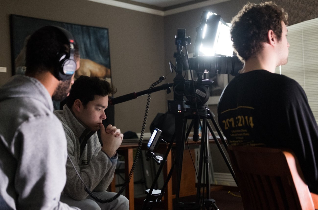 Several students work behind the video camera
