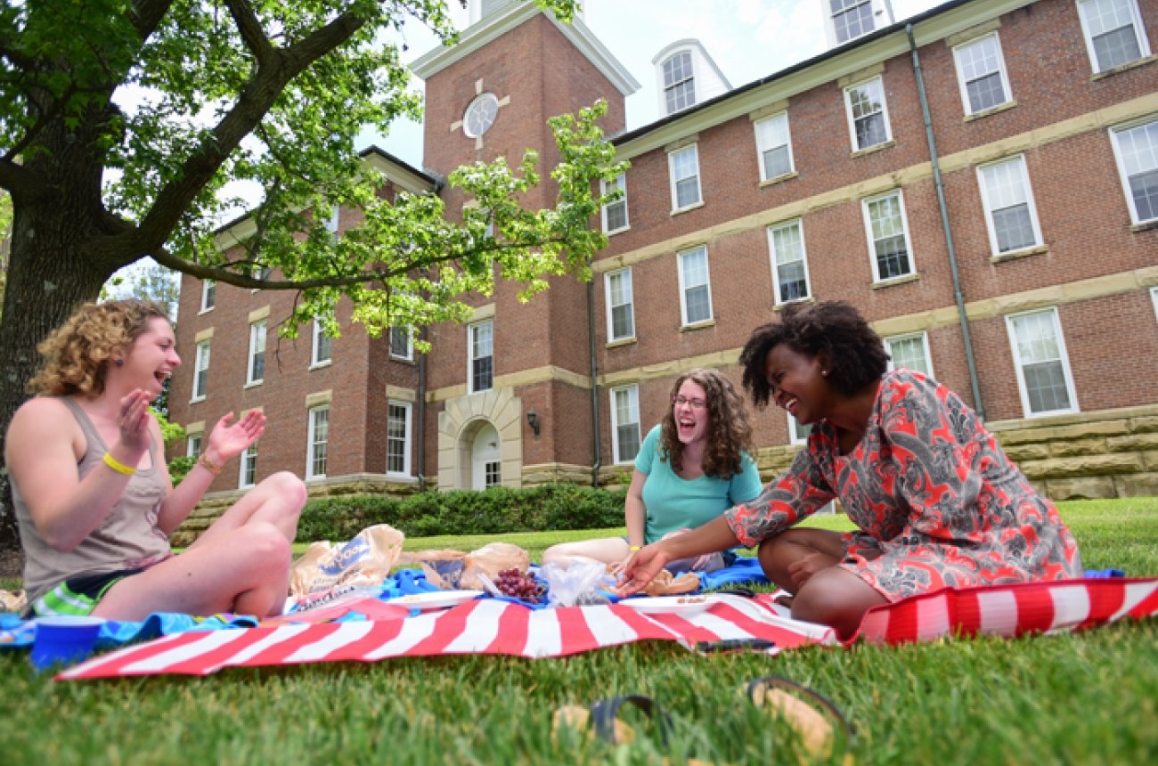 students having picnic at Breck beach of campus