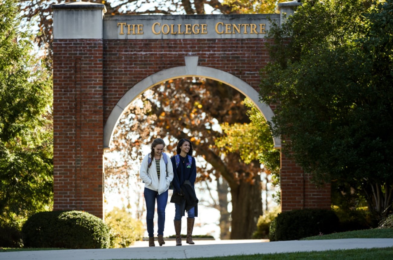 two students walking on campus near the College Centre Tunnel
