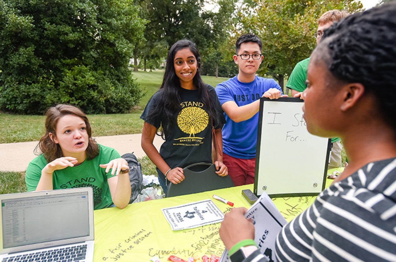 Students in conversation about a campus organization