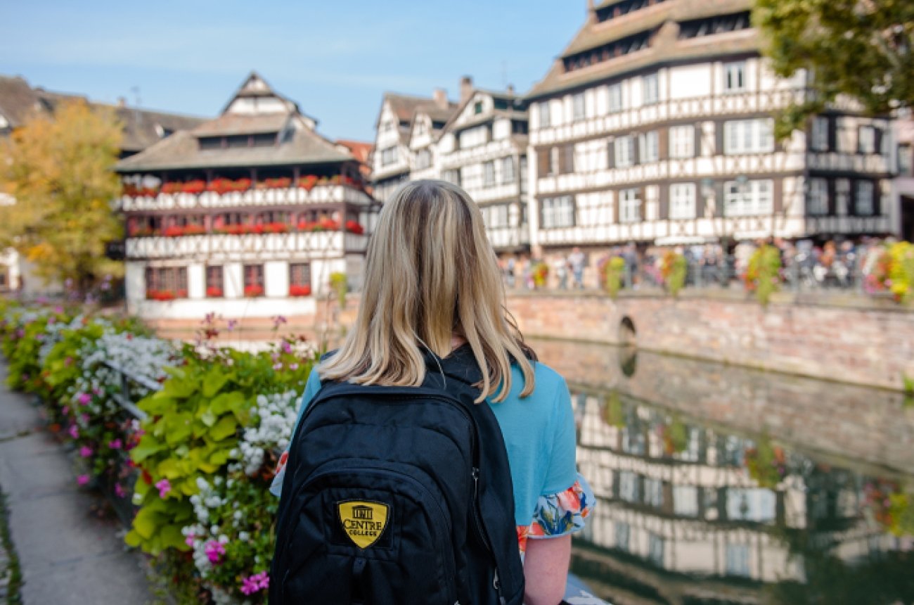 Student in Strasbourg with Centre College backpack on