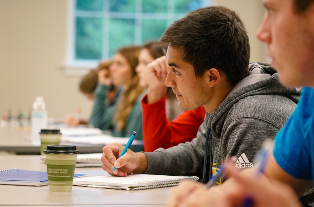 students listening to lecture in classroom
