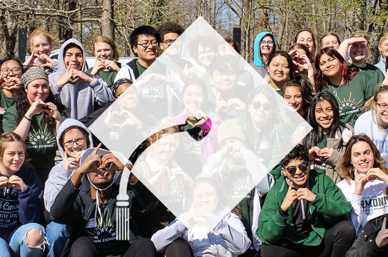 Bonner group of students using a heart symbol with their hands