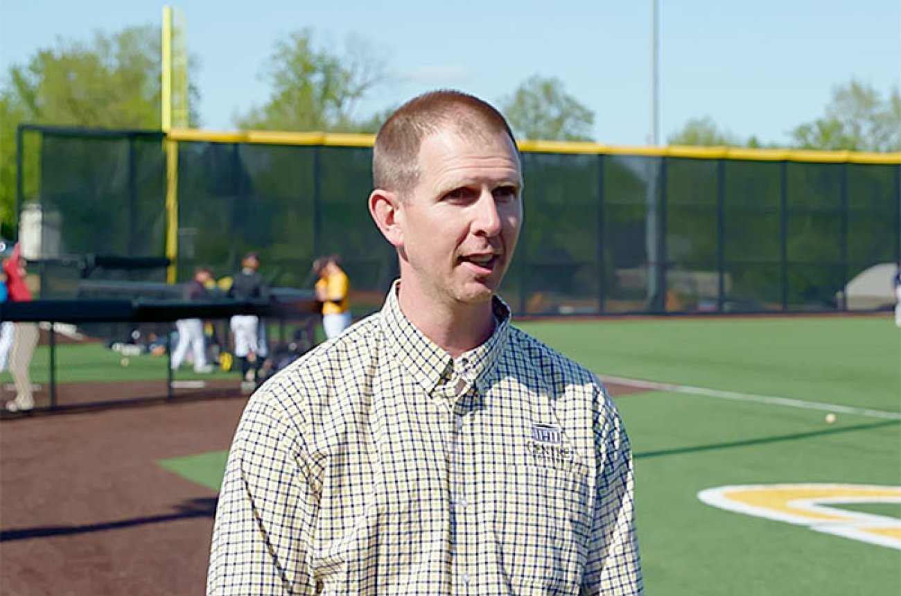 Dr Jeff Heath standing on the Centre College baseball field