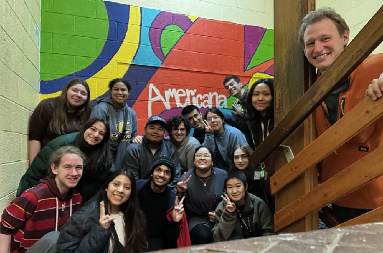 Group of students standing at Americana at a service project
