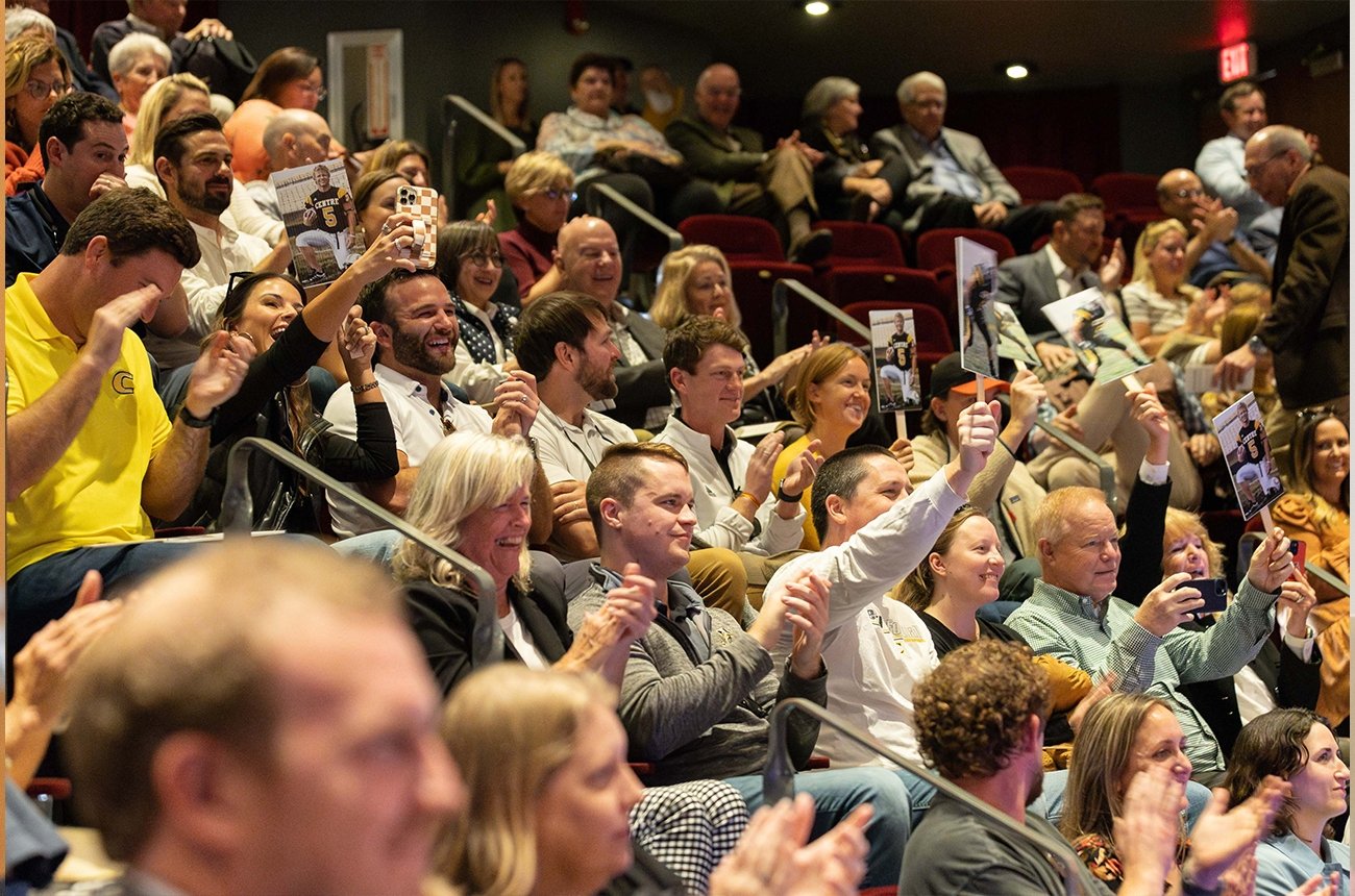 Crowd clapping at the Hall of Fame ceremony
