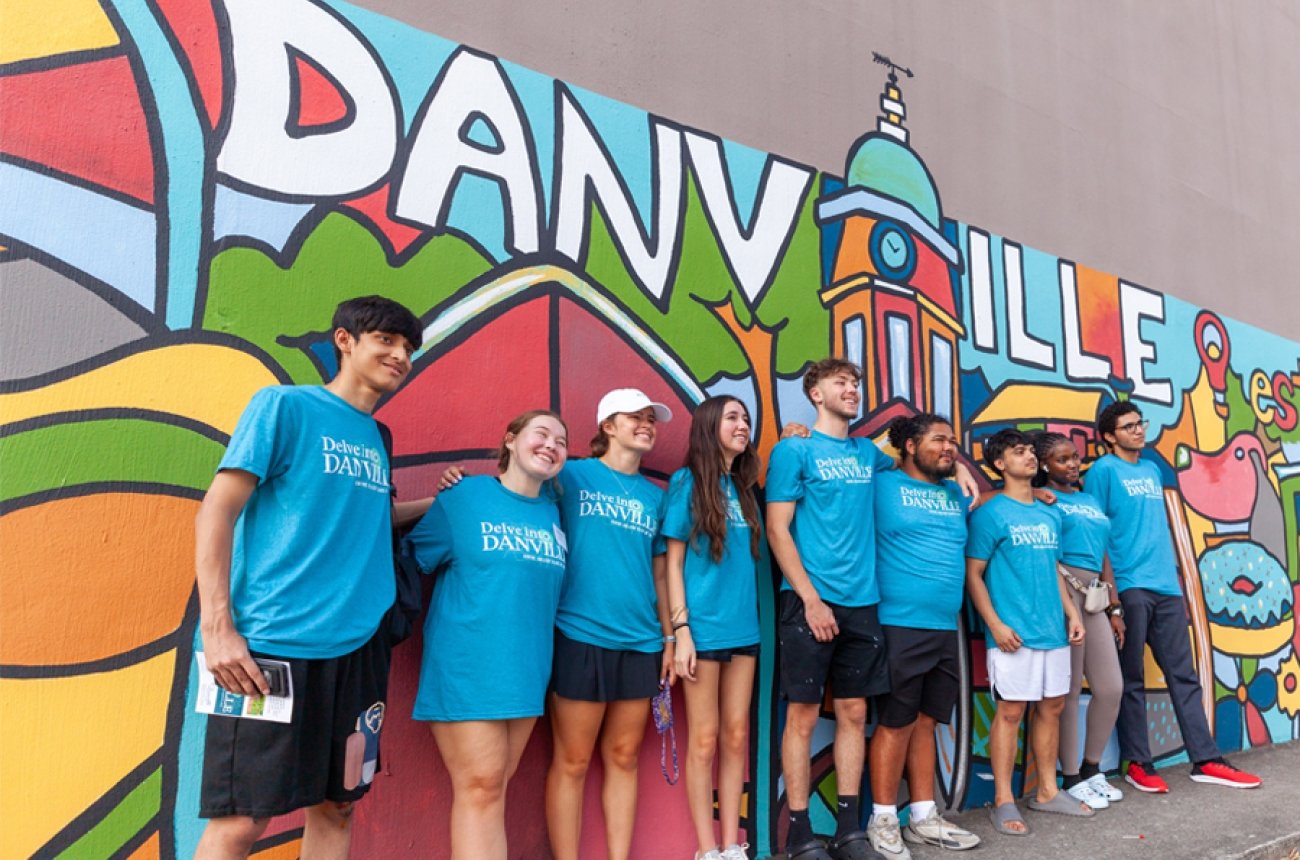 Students standing in front of Danville mural